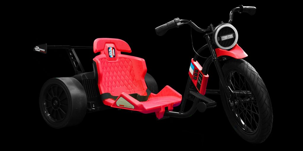 A red go-kart style tricycle with large rear wheels.